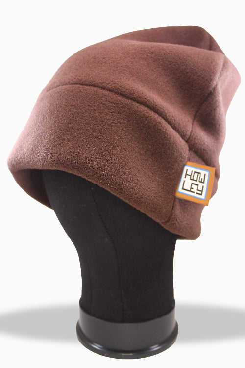 Brown fleece beanie on a mannequin head with a visible brand logo.