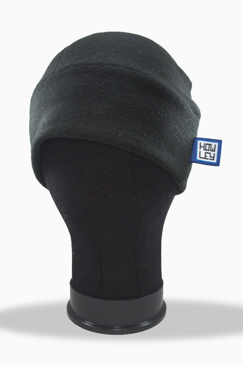 Black balaclava on a mannequin head with a visible brand logo against a white background